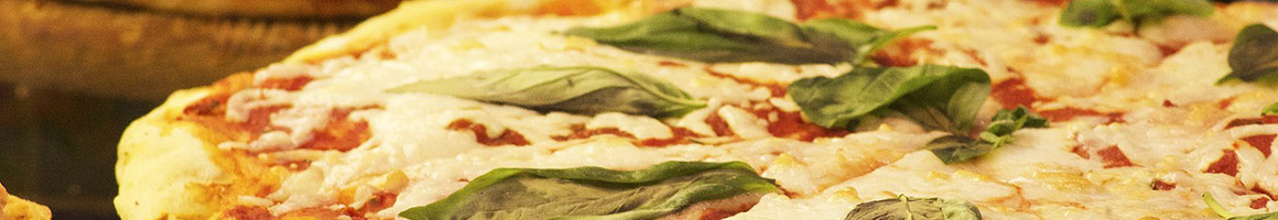 Eating Italian Pizza at Milano's Pizza restaurant in Somerville, TN.